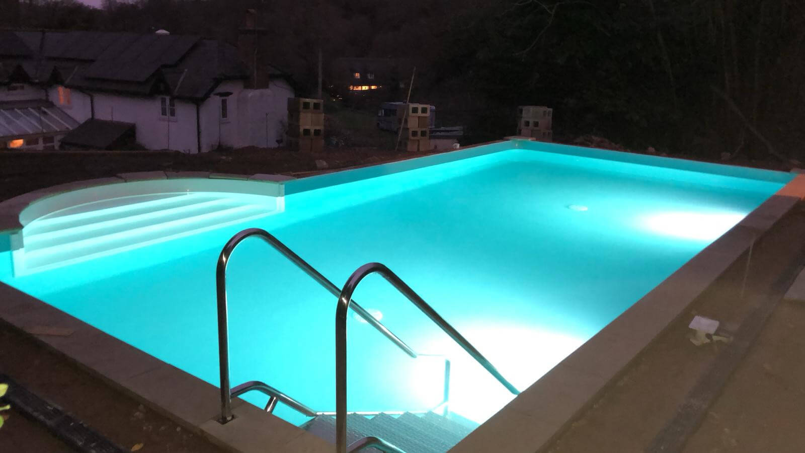 Illuminated pool at night time