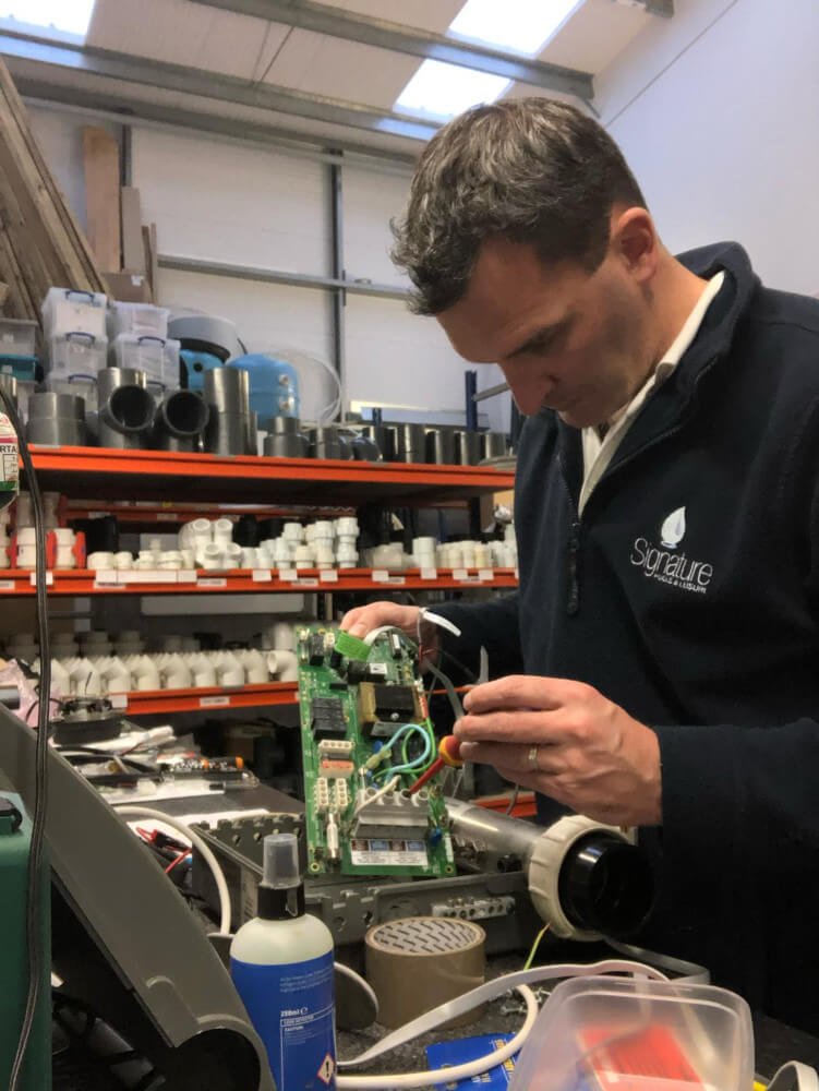 Man working with pool sensor systems